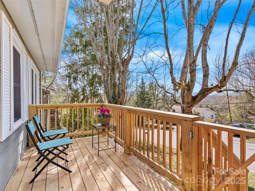 Experience the charm of this lovingly maintained 2-bedroom, 1-bath cottage in the desirable East-West Asheville neighborhood. Perched on a scenic .15-acre wooded lot, this home offers a picturesque, year-round framed view of the Western mountains. Recent updates include a newly renovated bathroom (2025), fresh interior paint (2025), and refinished original hardwood floors (2025). The home also features an oil furnace (installed December 2022), a new roof (July 2023), and a water heater (2018), ensuring modern comfort while preserving its historic character. Ideally situated near Asheville’s vibrant River Arts District, you'll have easy access to beloved local spots such as Hole Donuts, Pizza Mind, BattleCat Coffee, and The Admiral. Outdoor enthusiasts will appreciate the proximity to the French Broad River Park, RiverLink Bridge, and the RiverLink Greenway Trail, which wends along the river through the River Arts District. Welcome home to 310 Riverview Drive!