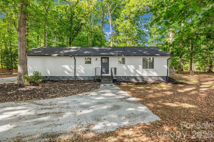 Completely updated on almost 2 acres of potentially subdividable land and just minutes from Lake Wylie access.  NEW roof, NEW HVAC, NEW Water Heater, NEW plumbing, NEW wiring, NEW lighting, NEW floors, NEW Kitchen, NEW appliances, NEW Doors, NEW Well pump, casing & holding tank. NO City Taxes! Create a multigenerational homestead or live in the renovated home and build an investment income producing property on the land.  It is all up to you and your imagination!