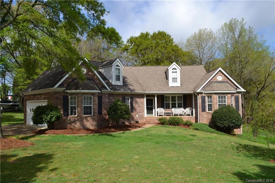 Brick front and vinyl sides and back for low maintenance Ranch in top condition with sunroom off the back overlooking 1.26 acre lot w/ huge trees. Split bedroom plan. Gas cooktop, granite counters, oak cabinetry, Dacor oven. Gas heat central air. 2-car garage.
