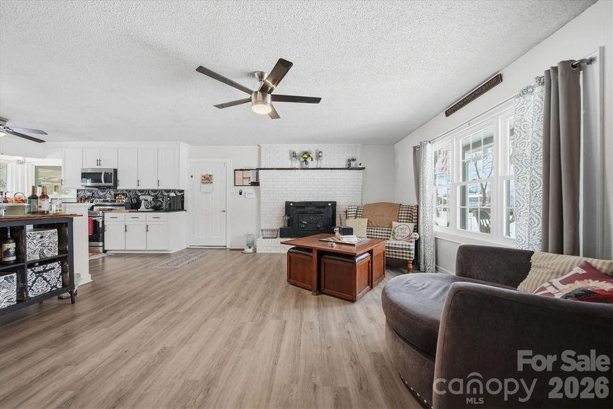 Charming, Updated 3BR/2BA One-Level Home in the Heart of Taylorsville! Welcome home to this beautifully maintained and thoughtfully updated ranch-style gem offering comfort, convenience, and impressive upgrades throughout. Nestled on a spacious lot with mature trees and wonderful outdoor spaces, this home is move-in ready and packed with features you’ll love. Step inside to an inviting open floor plan filled with natural light. The cozy fireplace anchors the family room, creating a warm and welcoming atmosphere. The beautifully updated kitchen boasts granite countertops, new appliances, a farmhouse sink, and modern finishes that make everyday living and entertaining a breeze. Relax in the spacious primary bedroom with an updated en-suite bath featuring a stylish walk-in shower. Additional bedrooms are generously sized, and both bathrooms have been updated. Enjoy peace of mind with major improvements already completed, including a new roof and gutters (2024), new light and fan fixtures throughout, windows replaced in 2019, and a fireplace liner replaced in 2020. A water softener system with whole-house reverse osmosis adds even more value. The crawlspace has been ecapsulated with an interior french drain, sump pump and commercial-grade dehumidifier. An exterior french drain was also added. Need extra space? The carport was converted into a bonus room in 2024 (no permits were pulled for this 727 sq.ft. bonus room included in the total 2090 HSF), perfect for a home office, playroom, or hobby space. Outside, you’ll find a 20x40 insulated detached garage with electricity—ideal for storage, a workshop, or additional parking. Enjoy the outdoors on the covered deck or front porch, entertain in the large fenced backyard (fence added 2018), and cool off in the above-ground pool during warm summer months. All this, plus an unbeatable location close to shopping, dining, schools, and more! This Taylorsville treasure has it all—schedule your showing today! PHOTOS UPDATED FEB 5 TO REFLECT FRESH INTERIOR PAINT!