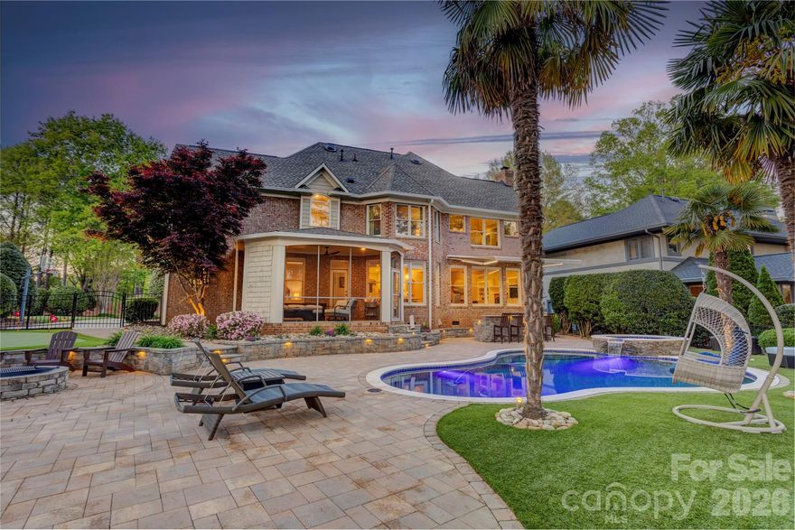 Welcome to this stunning and beautifully designed four bedroom, three and half bath home perfectly situated on River Run Golf Course in Davidson.  Enjoy breathtaking golf course views and a peaceful, yet fun, resort-style back yard.  The home's exterior features include a heated pool and hot tub surrounded by a beautiful paver area with several areas to relax in the sun.  There is also a fire pit area, a putting green and a bar/grill area with a remote controlled and lighted awning.  Step inside to discover a spacious and comfortable layout featuring abundant natural light and elegant finishes.  The open family room, breakfast area and gourmet kitchen enjoy beautiful views of the pool/spa area and the golf course.  The main level also includes a spacious dining room and well appointed office.  Out of town guests?  No problem!  There is a private guest room with an en-suite bath conveniently located on the main floor, just steps away from the screened porch.  There is even a doggie bath/spa for your fur-babies!  The upstairs primary suite is spacious and has a sitting area overlooking the pool area and the golf course.  Two secondary bedrooms share a nicely updated bath with a double vanity and step-in shower.  This home offers not just one, but two bonus rooms.  One is currently used as a billiard room and has a bar area and an amazing view of the golf course.  The second is currently used as a cozy TV room perfect for a night in with a movie.  This home checks ALL the boxes!  Don't wait, make your appointment today!