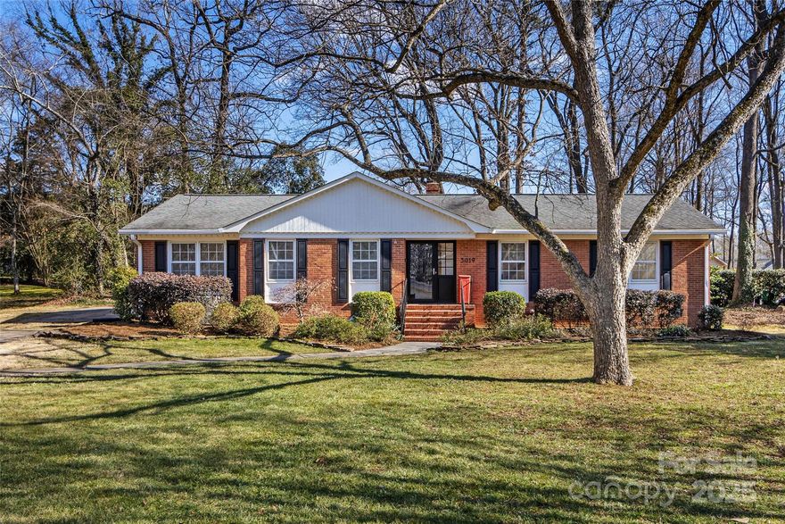 Classic brick ranch in Parkstone on a wonderful half acre+ lot conveniently located close to SouthPark. You will love all the natural light and the flow, with beautiful hardwoods, is perfect for entertaining guests. It has a roomy kitchen with a gracious island with SS GE Profile appliances that opens to a large den which overlooks a fantastic paver patio and a wood fired outdoor pizza oven that can be used almost 3 seasons of the year. There is plenty of storage inside and outside and also an outbuilding. In the warmer months there are grand hostas, gardenias, and 100 year old peonies that open up and bloom.This neighborhood has no HOA and has quick access to Park Road Park, the Greenway, the airport, plenty of shopping and other entertainment. Professional photos coming Saturday 1/25.