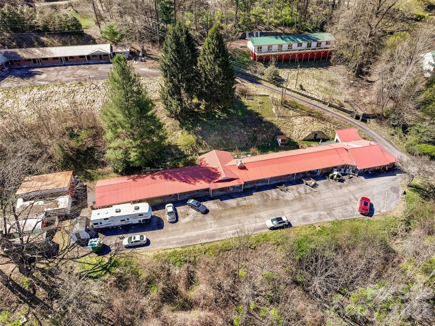 Investor Opportunity in Maggie Valley, NC!

Unlock the potential of this unique investment property located in the heart of beautiful Maggie Valley. Formerly operated as a motel, this property features 11 units plus a spacious 2,259 sq ft owner’s quarters offering 3 bedrooms and 3 full baths—perfect for on-site management or additional rental income.

The motel portion encompasses approximately 3,882 sq ft and is ready for a full renovation, making it an ideal project for investors looking to add value. Additional structures include a 630 sq ft detached garage/workshop and a 364 sq ft storage building, providing ample space for operations, storage, or future improvements.

With city water and sewer already in place, the groundwork is set to bring your vision to life. Restore it as a boutique motel, convert to multi-family rentals, or explore other income-producing possibilities.

Conveniently located near local restaurants, attractions, and just a short drive to Cherokee, NC and the Great Smoky Mountains National Park, this property offers strong appeal for both short-term and long-term rental strategies.

Property is being sold as-is, where-is; Extensive renovations required; Court-ordered sale – all offers subject to court approval and upset bid period; No financials available. Do not disturb tenants.

Don’t miss this chance to transform a well-located property into a profitable venture in one of Western North Carolina’s most visited destinations!