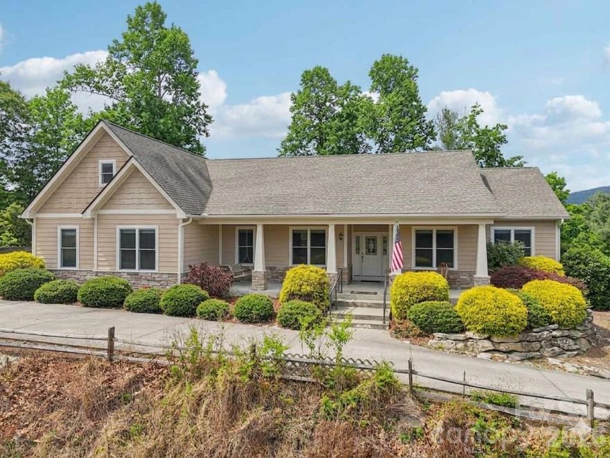 A welcoming single-level design offers relaxed living, highlighted by a front porch with a swing to enjoy the long-range mountain views, and a screened rear porch that opens to a covered deck and patio with similar vistas. The great room’s soaring ceiling and fireplace create a warm central gathering space, while a formal dining room with a tray ceiling adds elegance and functionality. The kitchen features quartz countertops, a great prep-island, a walk-in pantry, stainless steel appliances, and a breakfast area. The primary suite includes a cozy sitting area, a spacious walk-in closet, and a spa-inspired bathroom featuring a no-threshold shower with a bench and shampoo nooks, plus separate vanities. Guests enjoy an en-suite bedroom with a walk-in closet, along with a second guest bedroom that includes another full bathroom nearby. An office or flex room provides versatile space to suit your lifestyle. A main-level laundry room with a storage closet adds convenience and organization. Wood flooring runs throughout the main living areas, complemented by carpet in guest bedrooms and tile in all bathrooms, while a triple-car garage accommodates all your vehicles, followed by a small bonus room perfect for a workshop or exercise space, heated but not included in the main square footage. The large upper level bonus room above the triple garage adds extra living space for all your needs. An encapsulated crawl space and a small shed complete this exceptional property. Note: 64 East has been open all the way to this home.