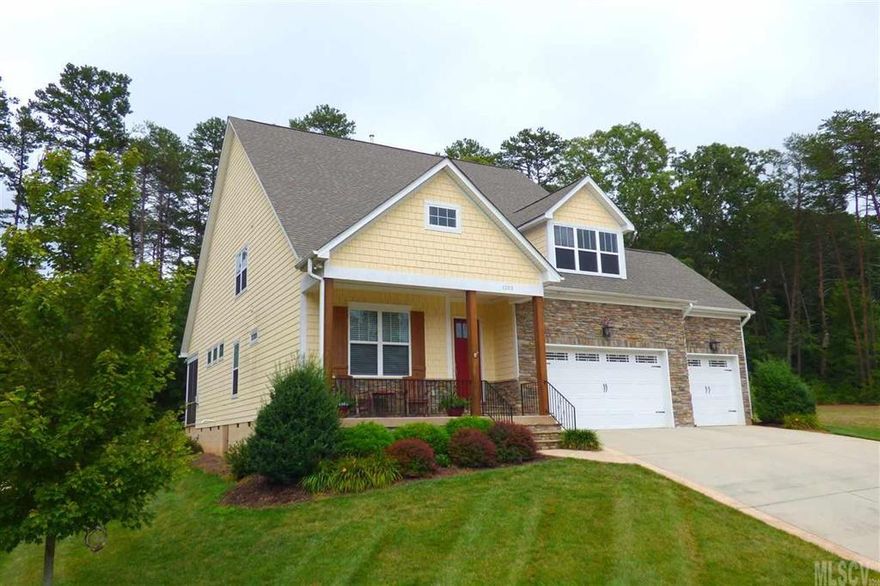 Quality construction in The Falls offers tall ceilings, wide moldings, hardwood floors, and a triple garage! This is the one you have been waiting for! The main level offers a stunning foyer with arched entry leading to the open living area, featuring a great room with corner gas fireplace, dining area exiting to the screened porch, and gourmet kitchen with bar seating, granite countertops, stainless appliances with gas range, pantry, task lighting, and more! The main level master suite is highlighted by a tray ceiling, huge walk-in closet, and relaxing bath with custom tile work, dual vanity, jetted tub, and tiled shower. You'll also find two additional bedrooms, hall bath, and laundry room on the main level. Upstairs, a huge bonus room/media room with wet bar opens onto a 4th bedroom, 3rd full bath, office, and huge storage area. Huge double lot offers 0.5 acre with level play area, patio, & screened porch. Stunning custom millwork throughout!