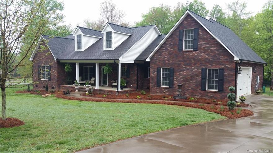 Beautiful custom brick home in South Rowan school district! Over 3000 sq ft with 4 bedrooms 3 full bath, office, and bonus room with bar/kitchenette .  This home offers fenced in backyard, detached large 30x40 workshop, hot/cold water outside, on large corner lot.  Open floor plan with new granite counter tops, tile backsplash, light fixtures, new kitchen appliances. Gorgeous large front porch.  This is a must see home!  Priced to sell.  Great location and no HOA! Convenient location to I-85