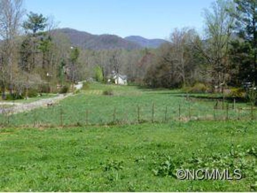 2.5 acres of gentle sloping pasture land. All utilities are available. Subdividable and room for 5 homes. Current zoning is R-2. Great investment opportunity for builder. Quiet subdivision of nicer homes in a great school district. 3 minutes to Airport Rd. and 15 minutes to Asheville or Hendersonville. Paved road frontage.