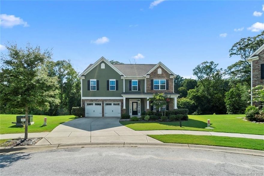 This 3 story house on a premium wooded lot in a culdesac is a RARE find in Walnut Creek! Not only do you have private access to the Carolina Thread Trail, but you can enjoy the privacy of your extra large backyard on your own paver patio with a fire-pit. If you think there is ample space outside wait until you see the inside! Downstairs includes an office with french doors, a formal dining room with wainscoting, a very spacious living room with a fireplace, a breakfast nook with a built in desk and a spacious kitchen equipped with an island, double overs and a travertine tile backsplash. On the second floor you have your choice of not one, but TWO master suites! You'll also find two secondary bedrooms, a full bath and the laundry room on the second floor. Last but not least, the third floor includes a loft area with the fifth bedroom and a full bathroom. Community amenities include walking trails, pool with splash pad, clubhouse, gym, playgrounds, tennis courts and ball fields.