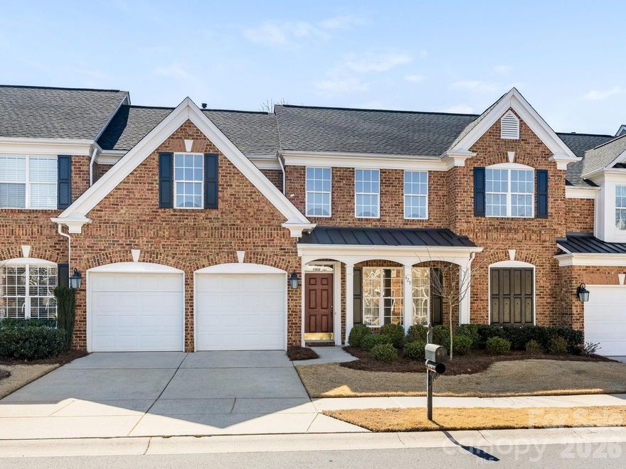 Welcome to 429 Eberle Way, a beautifully maintained brick townhome offering timeless style and effortless living just minutes from charming downtown Matthews. Inside, you're greeted by a light-filled dining room featuring an elegant tray ceiling, classic wainscoting, and new Mohawk laminate wood flooring that flows throughout the main level. The spacious living room impresses with vaulted ceilings and a cozy gas fireplace, creating the perfect gathering space. It opens seamlessly to the white kitchen, complete with ample cabinetry and new stainless-steel appliances. Off the kitchen, you will find a spacious laundry room. The main-level primary suite serves as a peaceful retreat, boasting tray ceilings and a generous en suite bath with double vanity, soaking tub, separate shower, private water closet, and a large walk-in closet. Upstairs, you’ll find two additional bedrooms, a versatile loft space perfect for a home office or play area, and a spacious full bath with double vanity and tub/shower combination. Enjoy outdoor living in the private, fenced-in patio and separate grass area — perfect for gardening or entertaining. A two-car attached garage and additional driveway parking. This thoughtfully designed townhome combines comfort and functionality in a prime location just minutes from historic downtown Matthews and the scenic Four Mile Creek Greenway — a place you’ll truly love coming home to.