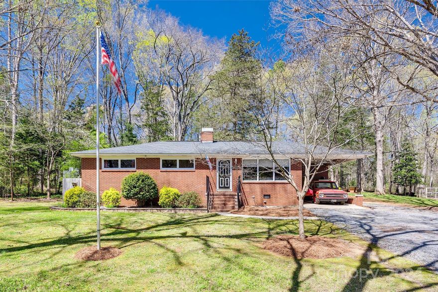 Welcome to 1041 Magnolia Drive! This 3 bedroom and 1 bath full brick ranch home is loaded with charm and sits on over 1 acre in Oakdale Acres. As you step inside, you’re greeted by a cozy living area adorned with fresh paint and hardwood floors, creating a bright and inviting atmosphere.  Enjoy relaxing on the large deck overlooking the backyard that has tons to offer from outdoor activities, gardening, or simply unwinding in nature. The home is located just minutes from I-77 and conveniently located near the Rock Hill Country Club.  With its great location, charming character, and attractive price point, this home presents an excellent opportunity for its new homeowner!