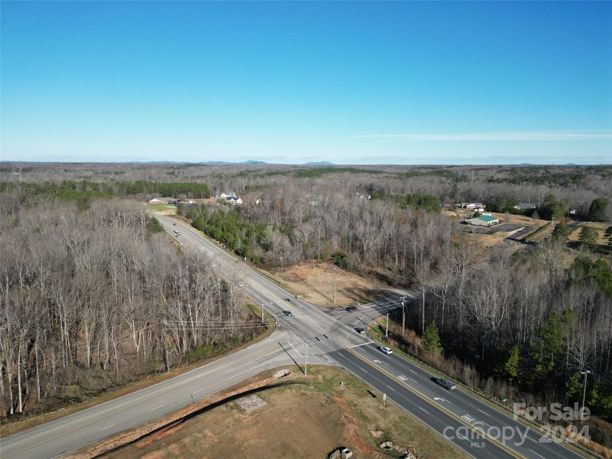 Prime Commercial Land Opportunity in York, SC
This 2.2-acre corner lot at Alexander Love Hwy and Lincoln Rd, locally known as the "Highway 5 Bypass," offers incredible potential in a rapidly growing area. Surrounded by new developments like Dollar Tree, two gas stations, Hardee’s, Arby’s, a car wash, and a credit union, this property is at the center of York’s expansion. With housing developments rising, future demand is expected to soar, making now the perfect time to buy.
Caddy-corner to York Intermediate High School, it boasts excellent visibility and accessibility. Zoned HC - Highway Commercial and part of the Gateway Corridor District Overlay (GCDG), it offers diverse possibilities and the prime location makes it an unbeatable investment. Secure this property today and capitalize on York’s growth. Contact us for details or to schedule a site visit!