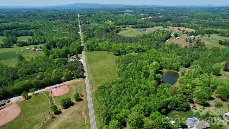 1.75 acres in the heart of West Lincoln off Hwy 27 West. Wooded lot with substantial road frontage and room to build, grow, and spread out.Water available along Hwy 27; taps required. Buildability to be confirmed with Lincoln County prior to closing. Plat map attached.