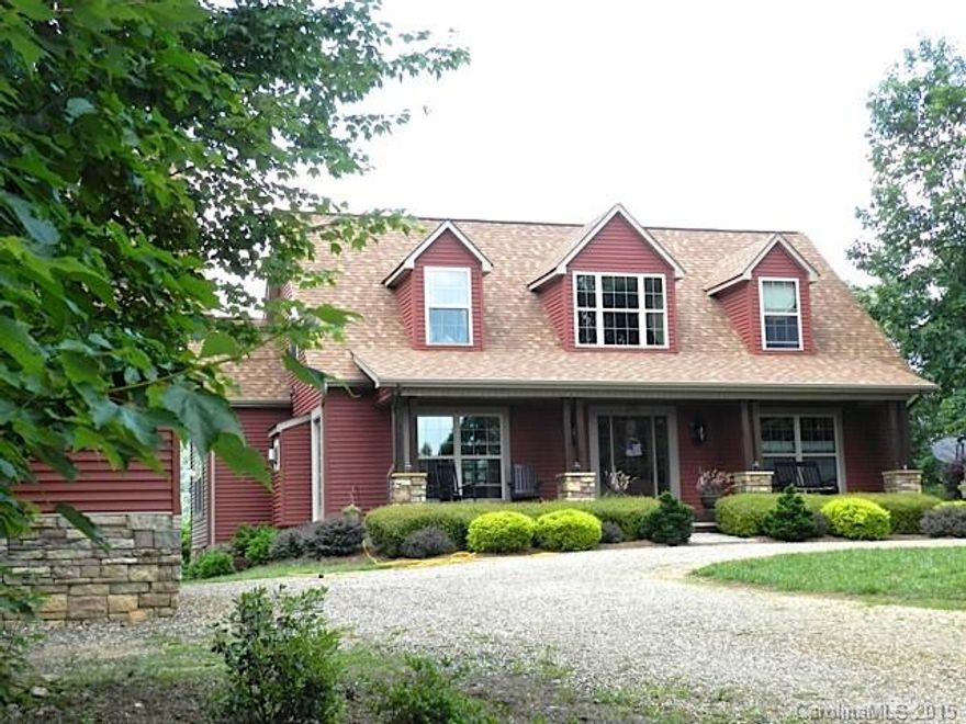 Gorgeous long range views from front & back of home. Located next to 800 acres of trails by Barrett's Mountain. Main level master suite. Open floor plan w/tons of custom upgrades includes Rainforest granite. Stone FP w/gas logs, hardwood floors. Laundry room w/sink & closet. 2nd floor offers sitting loft, 2 BRs & full BA w/1930's claw foot tub & shower. Lower level offers Rec room, exercise room & workshop. Level lot w/natural boulders. Rinnai water heater, heat pump w/wood fire boiler back up.