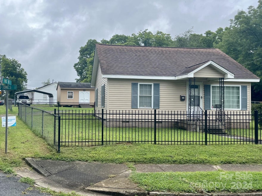 What a great find! Perfect starter home. Close to I-77 and downtown area, Winthrop University, shopping, and dining.  This well taken care of house is located on a corner lot with secure fence in front and side yard plus partially fenced back. City street lights provide abundance of light for property. Updated electrical, plumbing, insulation, and HVAC. New dining room/laundry added in 2016. Enjoy 16X24 storage shed and double carport. Washer, Dryer, Convection Oven, and Refrigerator convey. HVAC system still has a full parts in labor warranty until 2026.