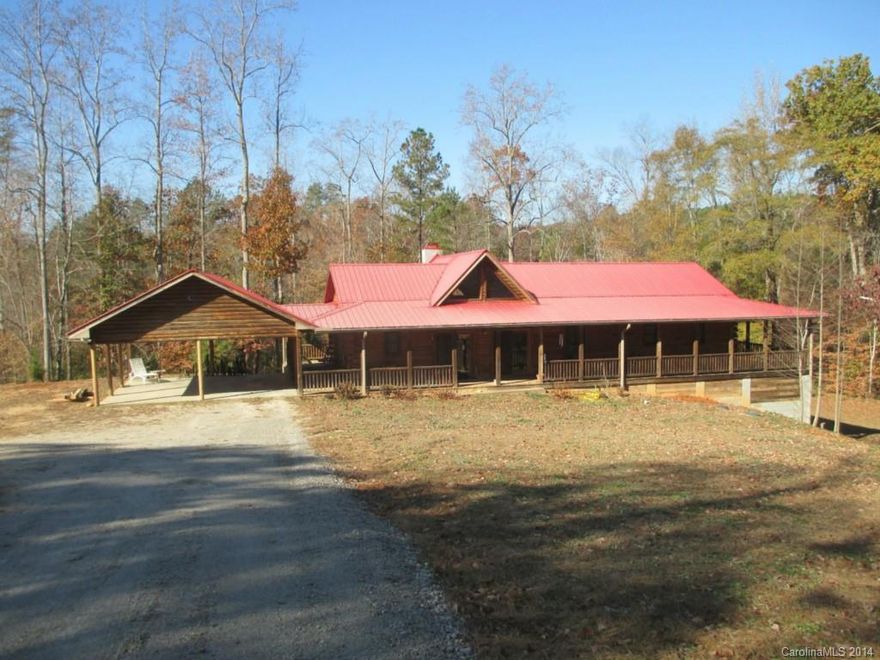 Log home with all the privacy you could want on 40 wooded acres. Living area is open with lots of windows and insulated doors to enjoy the view that surrounds the home or you can watch the seasons change as well as all the wildlife from the wrap around porch. A walkout basement with roll up door is on the right side of home for attached storage and a detached 30x20 wired and insulated workshop with full bath. Utilities should be desirable with private well, septic and electric heat.