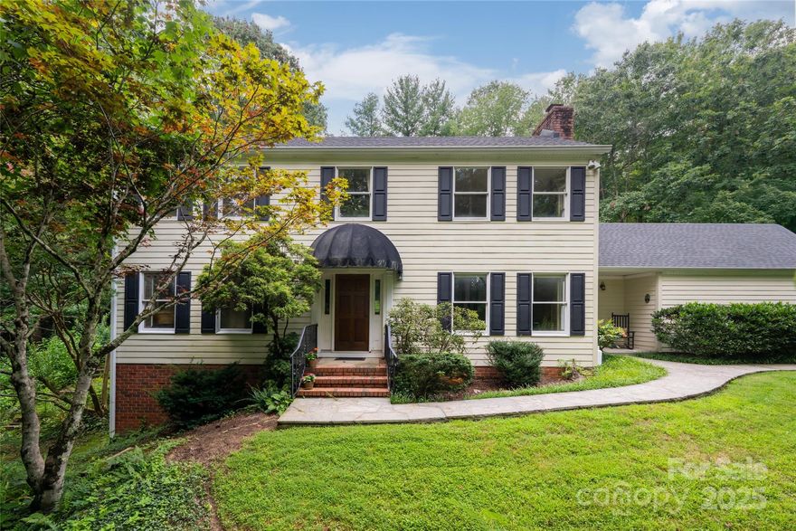 Tucked away on a quiet, tree-lined street in desirable South Asheville, 36 Charlyn Drive offers over an acre of privacy and potential. Set on a 1.17-acre wooded lot, this 4-bedroom home, built in 1984, is perfect for buyers seeking space, character, and the opportunity to make a home their own.

Inside, you'll find comfortable living spaces, plenty of natural light, and timeless details throughout. The layout includes both formal and informal living areas, a wood-burning fireplace, and a full basement offering flexible space for storage, hobbies, or expansion.

Outside, enjoy mature trees, a large backyard, and quiet surroundings—ideal for gardening, play, or simply relaxing in nature.

Located just minutes from Biltmore Park, the Blue Ridge Parkway, and all south Asheville has to offer this home combines convenience with peaceful, suburban living.