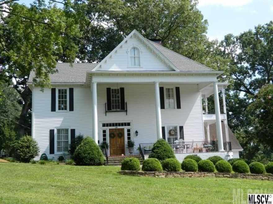 Classic colonial home featuring high quality craftsmanship & materials. This home has been totally updated while still trying to maintain the style & appeal of the era.Main level offers large rooms, high ceilings, detailed moldings, foyer, winding staircase, LR, den, updated kitchen with granite countertops, farmhouse sink, rohl faucet, appliances and wine cooler. 2nd level has a huge landing, master BR with private balcony, 2 additional BRs and 2 baths. 3rd level has 3BRs, 1BA, and attic storage. Detached double garage with bonus room and half bath. Beautifully landscaped yard. View of downtown Lenoir. Bed and Breakfast possibilities!