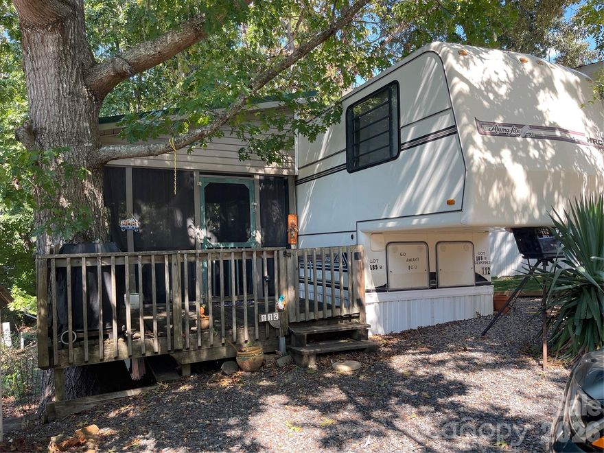 It's time to get your own lake getaway! This is a 1988 Aluma-Lite XL 5th wheel camper located on a deeded lot in Badin Shores resort on Badin Lake. There is a large attached screened porch with a metal roof that is perfect for relaxing or enjoying your morning coffee. Badin Shores offers many amenities: swimming pool, putt-putt course, basketball courts, boat ramp, fishing pier, waterfront boardwalk, and so much more
The main bedroom has a queen size bed. Sofa in living area opens to full-size bed. Futon on porch opens to full-size bed. 
Property located on a shaded lot, on a quiet and short cul-de-sac street. 
The seller enjoyed a Fall/Winter lake-view and limited lakeview Spring/Summer.
