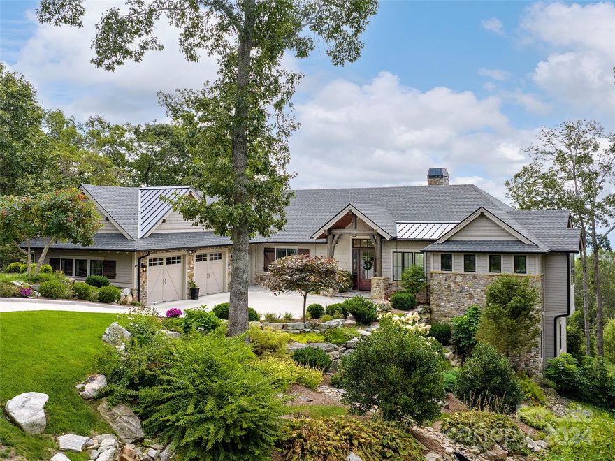 Stunning mountain-contemporary in beautiful Grand Highlands, designed by architect Wayland Shamburger. Enlarged picture windows offer over 180 degrees of long range vistas and gorgeous landscapes. The abundance of natural light is staggering, as the home was perfectly positioned deep on the property with an emphasis on privacy and southern exposure. With a brilliant flow of design, the floor-plan provides seamless transition and main-level living. Energy-efficient, with multi-zone heating and cooling, geothermal, generator, and humidity control systems. Centralized audio/video system with surround sound ideal for entertaining guests or relaxing in the 6-person hot tub. Terrace level offers two sizable bedrooms and multiple "flex" spaces perfect for family overflow or crafts. The foam Insulated and heated garage is customized with space for two cars and a golf cart bay providing direct access into the home. Terraced hardscapes and rows of seasonal floral adorn the hillside.