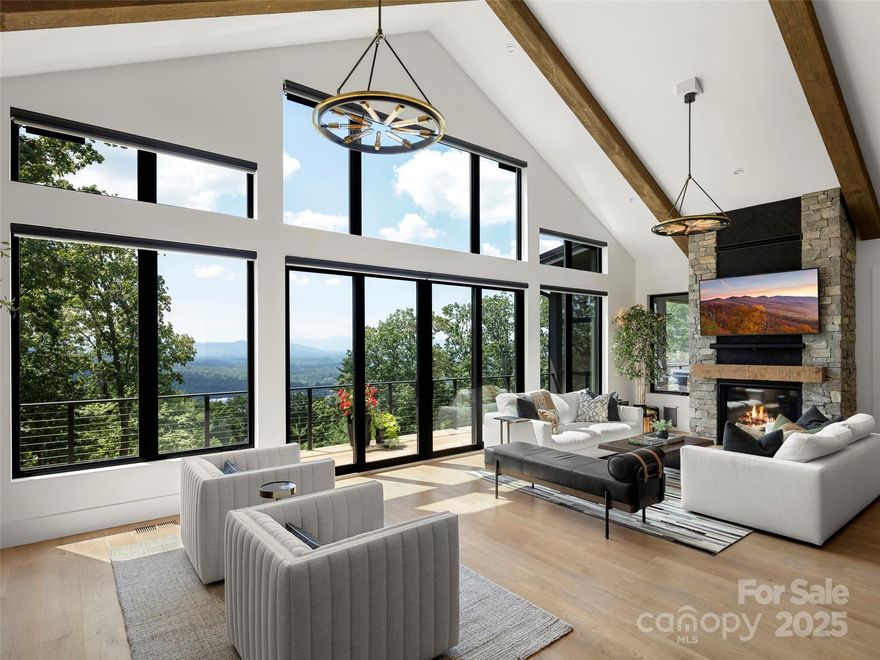 Set on over two private and gated acres, this mountain modern residence defines refined luxury. Built by an award-winning Parade of Homes builder and perfectly sited to capture long-range views of South Asheville and the Blue Ridge Mountains, the home offers complete privacy while just two miles from groceries, fitness, and conveniences. Featuring main-level living and green-built efficiency, it’s an ideal primary residence or effortless second home. Floor-to-ceiling windows fill the interiors with natural light and frame breathtaking mountain views. Open living areas flow seamlessly to outdoor spaces for entertaining or a quiet retreat. With three bedrooms and three-and-a-half baths, this home blends craftsmanship, comfort, and style while creating a private, sustainable, and elegant mountain sanctuary.