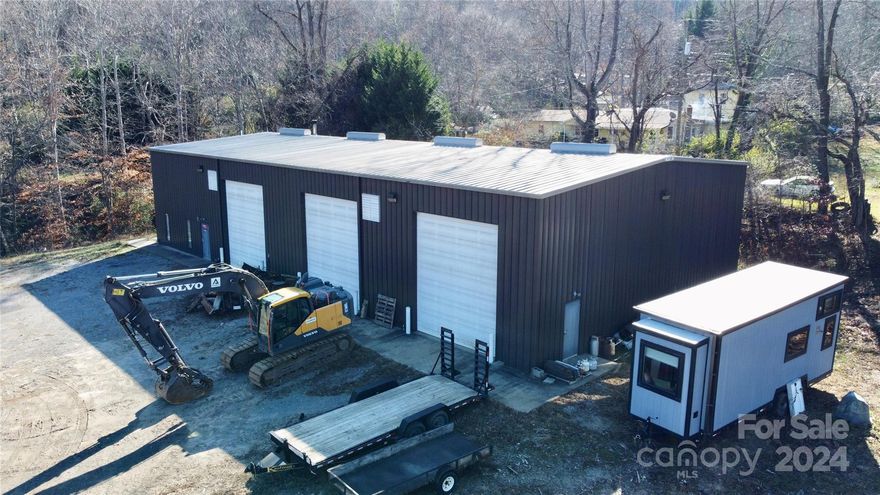 Unique opportunity! Zoned as R-2. Located 10-15 minutes from Downtown Asheville. 5,500 square foot metal building. The building is insulated and heated. It has three 16'x14' bay doors with two office spaces. Easily accessible to I-40.