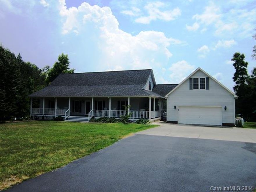 Paradise! Beautiful 11 acre property on 12 acre lake!  Custom built home w/wrap around porch front to back.  Lg kitchen w/ctr island, breakfast rm, GR w/fp, MBR on main all w/water views! Formal DR.  Two large BR's up w/walk in closets.  Att. 2 car garage w/bonus above, det 30 x 36 2 car garage w/patio & sink.  Above ground pool plus fishing pier.  Fenced pastures and 2 stall barn w/water and power.  Breathtaking views!