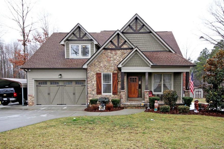 You must see this Custom Built Home located on .85 of an acre located just outside of town , Low Taxes and NO Home Owners Dues , Numerous Upgrades include , Southern Yellow Pine Floors, stone fireplace with gas logs, Upgraded appliances including double convection oven , solid doors , iron balisters, Master w /vaulted ceiling, wired for stero, Granite Counter-tops in kitchen , some tile floors, Master on the main . Workshop , Oversized Deck overlooking wooded backyard .