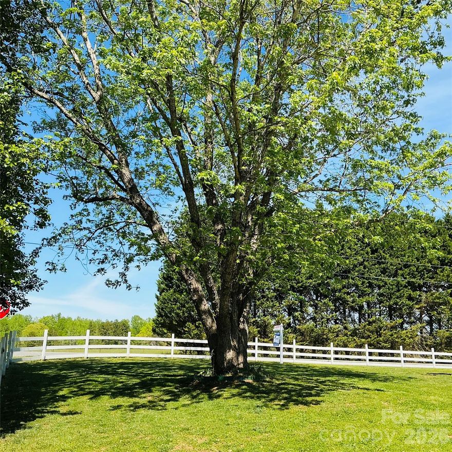 Beautiful farmhouse situated on a 1.6 acre corner lot completely updated top to bottom without losing its farmhouse charm. Extensive use of shiplap with light flooring and walls. Open floor plan boasts over 3,600 sq ft consisting of 6 bedrooms, 4.5 bathrooms! Outside there are 2 covered porches; an in-ground pool; a pool house w/bathroom; storage buildings; a gigantic 800 sq ft attached garage! AND a 2,400 sq ft detached workshop w/3 bay roll-up doors and office space, perfect for RV storing, hobbies, auto collection, workshop, or whatever you can imagine. The chef-worthy kitchen is a masterpiece with custom cabinetry w/pull-outs; beautiful quartz countertops; center island with butcher block top providing added workspace; an island with seating for entertaining; big farmhouse sink; walk-in pantry w/built-in cabinetry and wood countertops; and the charming pine beadboard ceilng is the 'frosting on the cake' in this beautiful kitchen. The Great Room/Dining Room with its soaring vaulted ceiling is anchored by a cozy fireplace and custom built-ins offering the perfect setting for gatherings and making memories. Library/office/den room with wall of built-in shelves/cabinets. The main floor bedroom wing has a full bathroom, an additional attached room for possible office or den with a full loft above, perfect for second living quarters. There's a mudroom w/built-in floor to ceiling shoe rack. Main floor laundry room with cabinets, built-in sink and folding table. Upstairs you'll find room for everyone with a loft gathering area, 5 bedrooms and 3 full bathrooms! The primary bedroom has a newly remodeled bathroom with a slipper tub, walk-in shower and dual vanities. Down the hallway you'll come to 4 additional bedrooms, one with an en-suite full bathroom, and at the end of the hall another full bathroom. Going through the French doors to the rear yard you can relax under the large covered porch or swim in the beautiful in-ground large rectangle swimming pool. All of the equipment, including the well equip is safely housed in the 'pool house' safe from weather deterioration. If your inner farmer is what calls you to this property you'll find plenty of space for raising chickens, goats, or growing your own food. You'll enjoy room to spread out with the zoning being a minimum of 3/4 acres in this area of Iron Station. A rural property that is only minutes from shopping, restaurants and schools. Charlotte is a quick drive down Hwy 16. Low Lincoln County property taxes. There's a small triangle parcel of 0.09 acres included  so there are two parcels in this sale totaling 1.6 acres.