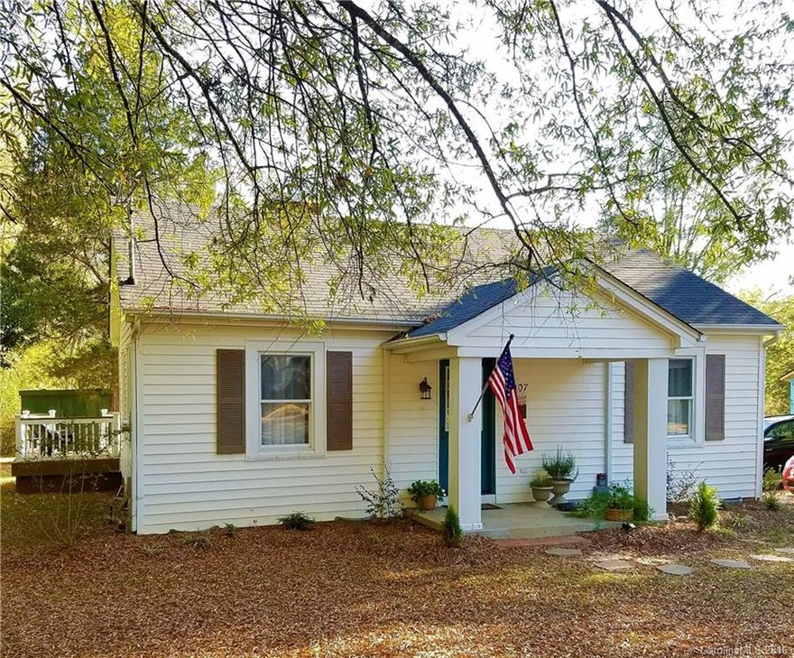 Charming Move in Ready home in the Heart of Clover. Impeccably maintained and tastefully decorated throughout. Kitchen and bathroom have been updated. Separate laundry room. Windows replaced with new tilt in/easy clean windows.  Interior has been painted. New carpeting. Great covered front porch and a back deck for relaxing or entertaining. Ceiling fans throughout. Natural gas fireplace. Refrigerator, Washer, Dryer included.  Outdoor storage building also included. MUST SEE!!!