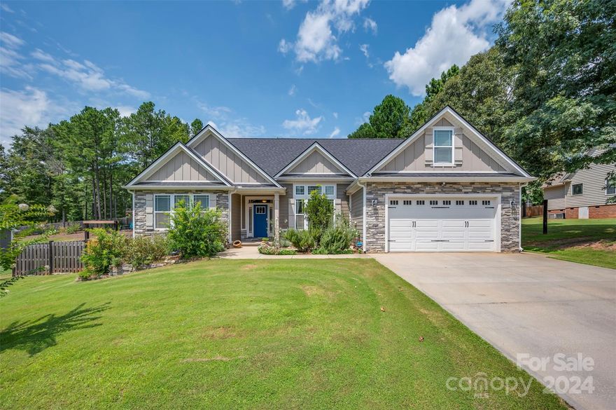 Welcome to this beautiful home in Cane Creek's quiet & desirable neighborhood. Built by Enchanted Homes, this meticulously maintained 4BD/2.5BA home is nestled on a spacious half acre. Inside, the home offers a functional split floor plan, 11’ vaulted ceilings & natural light w/ floor-to-ceiling windows. Combining functional elements & elegance, this house provides a comfortable space to spread out & call home. Outside, the fenced backyard offers privacy & room to roam. A separate garden space provides raised garden beds, berry bushes, & fruit trees ripe for your gardening pleasure. Enjoy outdoor living w/ a covered patio & a cozy fire pit area. The front landscaping is equally impressive w/ different varieties of established roses, lavender, rosemary, & pomegranate trees. Located in Sptbg's District 1 schools w/ convenient access to the future Saluda Grade Rail Trail. Easily commutable to Asheville (50 mins), Greenville (40 mins) or Spartanburg (25 mins). Move-in ready! Must See!