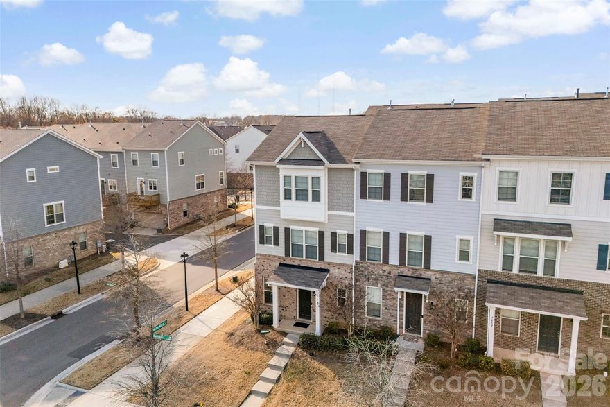 Welcome to this beautiful three-story END-UNIT townhouse! The first level welcomes you with a generous entryway, a home office, and a two-car garage.

Upstairs, the main floor offers an inviting open-concept layout with 10-ft ceilings and abundant windows and natural light. The kitchen is beautifully appointed with granite countertops, 42-inch gray cabinets, a tile backsplash, stainless steel appliances, and a gas double oven range. The refrigerator is included! The walk-in pantry provide ample storage space.

The third floor features two spacious bedrooms, each with its own en-suite bathroom. The primary suite boasts a tray ceiling, a large closet, and a bathroom complete with a double vanity and walk-in shower. The washer and dryer are also included.

The community amenities include a resort-style outdoor pool with plenty of seating, a cabana, grilling area, lawn/landscaping maintenance and more! Ideally located close to the Arrowood light rail station, this home offers easy access to I-77 and South Boulevard for a seamless commute. And enjoy nearby outdoor recreation with multiple greenway entrances within two miles. Come check it out!