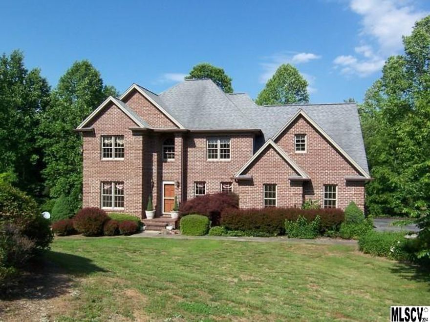 YOU WON'T FIND THIS MUCH SPACE WITH THE ABILITY TO ACCOMMODATE 5 BEDROOMS AT THIS PRICE ANYWHERE ELSE!! This stately brick treasure boasts lovely cathedral & tray ceilings & pretty moldings, along with a LOVELY VIEW OFF THE BACK SCREENED DECK OR PATIO BELOW! It's roomy enough to accommodate even the largest family with up to 4BRs on the 2nd floor, while offering a separate suite w/full BA in the finished basement. But, if BRs are not what you need, enjoy a huge office suite; or, excellent recreation &/or workout area. The heated garage space on that level will be useful, as well. The formal LR and DR are complimented by a cozy Den off the open kitchen where cuddling up next to the gas logs will be a favorite pastime. Double garage parking is on the main level & just off the kitchen for convenience. AT THIS PRICE, YOU HAVE PLENTY OF ROOM FOR ANY UPGRADES THAT SUIT YOUR TASTE! THIS SELLER IS MOTIVATED, SO TAKE ADVANTAGE OF THIS AWESOME OPPORTUNITY TODAY!