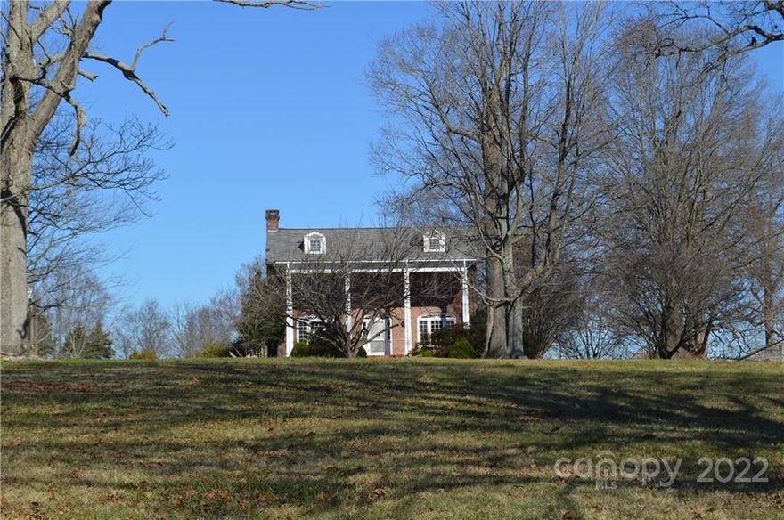 Amazing 77-acre tract of land that is located within 4.1 miles access of I-77 and I-40 and 1.2 miles to Highway 70, with 1,575 feet of railroad fronting the subject property along Old US Highway 70. The property has access to county water and sewer access can be obtained from the City of Statesville along John Long Rd. The property is currently zoned for RA; however, the surrounding property to the east and south is zoned through Iredell County as heavy manufacturing and the City of Statesville Industrial Park is within a quarter mile. The adjoining property to the North is a planned urban development approved through Iredell County. The property has been   a family estate that has been actively farmed; there is a stately two-story brick home with barns and outbuildings also located on the property.