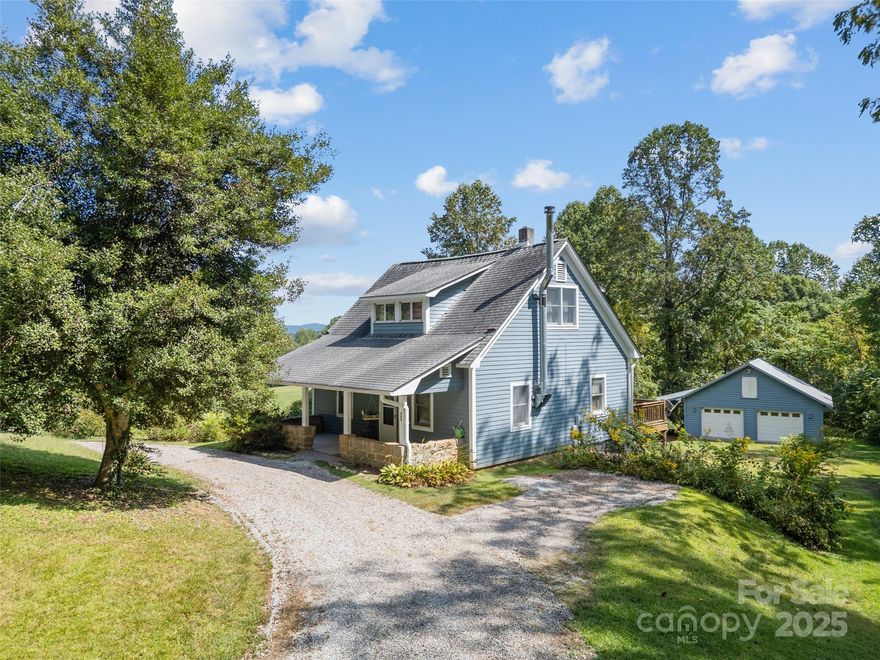 Welcome to 560 Esseola Street in the charming town of Saluda, where historic character meets open pastures and mountain views. This two-bedroom, two-bath residence includes a main-level flex space that can serve as a bedroom if one-level living is desired, or as an office or studio. Originally built in 1903, the home was fully renovated in 1987, blending its timeless appeal with modern comfort.

The property encompasses 8.09 acres in total, offering both unrestricted living and the protection of agricultural conservancy. The 1.09-acre homesite provides privacy for the residence, while the additional seven acres, preserved with the Saluda Community Land Trust, feature 5.21 acres of rolling pasture framed by beautiful mountain views. Horses and livestock are welcome, and barns or agricultural outbuildings are permitted, while residential development—including guest houses—is not allowed. The result is an estate that preserves open space and pastoral charm while still offering versatility for equestrian or farming pursuits.

A highlight of the property is the impressive detached garage and workshop, designed with country living in mind. This oversized structure includes a hay loft, tractor storage, and ample room for projects, hobbies, and equipment. It serves as both a functional asset and a centerpiece for the property’s agricultural potential.

Together, the residence, land, and outbuildings create a rare offering in Saluda. Whether you envision keeping horses in the pasture, enjoying the privacy of wide-open land, or simply retreating to a home with enduring character, 560 Esseola Street presents a lifestyle that is both timeless and practical. With history, space, and mountain beauty woven together, this is a property to be cherished for generations to come.