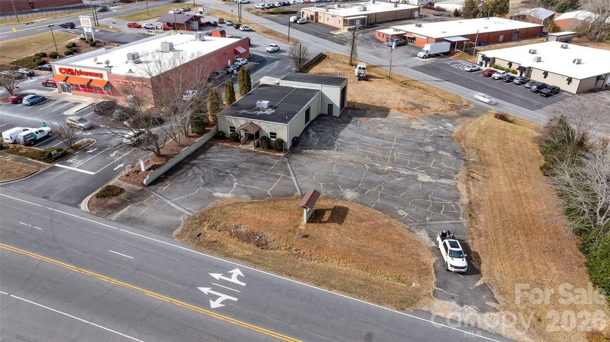 Owner-Financing available with acceptable terms. Prime location in Conover, ready for a new business! This building offers a tremendous opportunity as a blank canvas to create a valuable addition for the town's residents. With approximately 1000 square feet of finished office space, broken into 3 sections, and 2 large warehouse bays with roll up doors, accessibility is a breeze. The property also has 2 points of egress on highly trafficked roads, which will provide optimal visibility. Plenty of parking on the asphalt lot. Grass area could be used in a number of different ways. There is a monument sign constructed on the Rock Barn Road side of the building, ready to advertise a new company! Don't miss out on the chance to take this location and building to the next level! Owner is a licensed NC Broker.