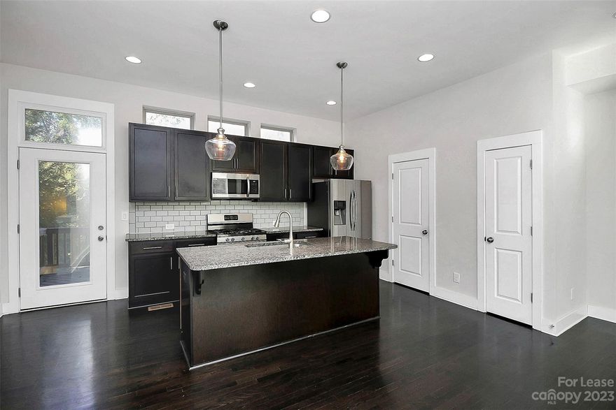 Very large 2 bedroom, 2.5 bath, 2 car garage townhome in NoDa.  Home is in superb condition and features include front door Smartlock, Nest thermostats, master bedroom ceiling fan and Container Store custom shelving and more.  Home has fenced in back patio (tenant maintains), oversized elevated back deck w/ Natural gas hook up for (tenant provided) grill and very large two car garage.  Community is walkable to center of NoDa and has a community dog park.  HOA pays for water/sewer/trash and front door landscaping.  There is an active RR track behind the home.