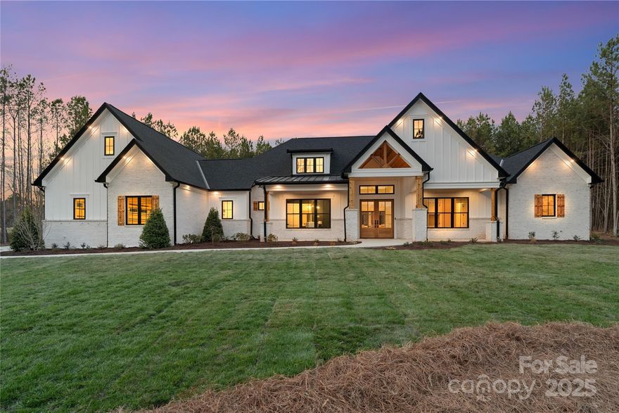 Luxury, privacy, and impeccable craftsmanship await in this stunning new construction ranch in Catawba Shores Estates. Situated on over 2 acres, this home offers an exceptional lifestyle with 4 Bedrooms, 6 Bathrooms, a dedicated office, and a moody bonus room. The open floor plan showcases high-end finishes, abundant natural light, and a chefs' kitchen with quartz countertops, top-of-the-line appliances, custom cabinetry, and a grand island. The primary suite is a retreat like no other, boasting a spa-like ensuite and a walk-in closet fit for a dream wardrobe. A secondary primary bedroom adds versatility for guests or extended family. Enjoy cozy nights by the indoor fireplace, or take the gathering outside to the covered patio with a natural gas stone outdoor fireplace. The outdoor grilling area is built to impress, featuring a leathered granite bar, sink, and a Blaze 5-Burner grill ideal for cookouts and entertaining year-round. More than just a home, this is a lifestyle.