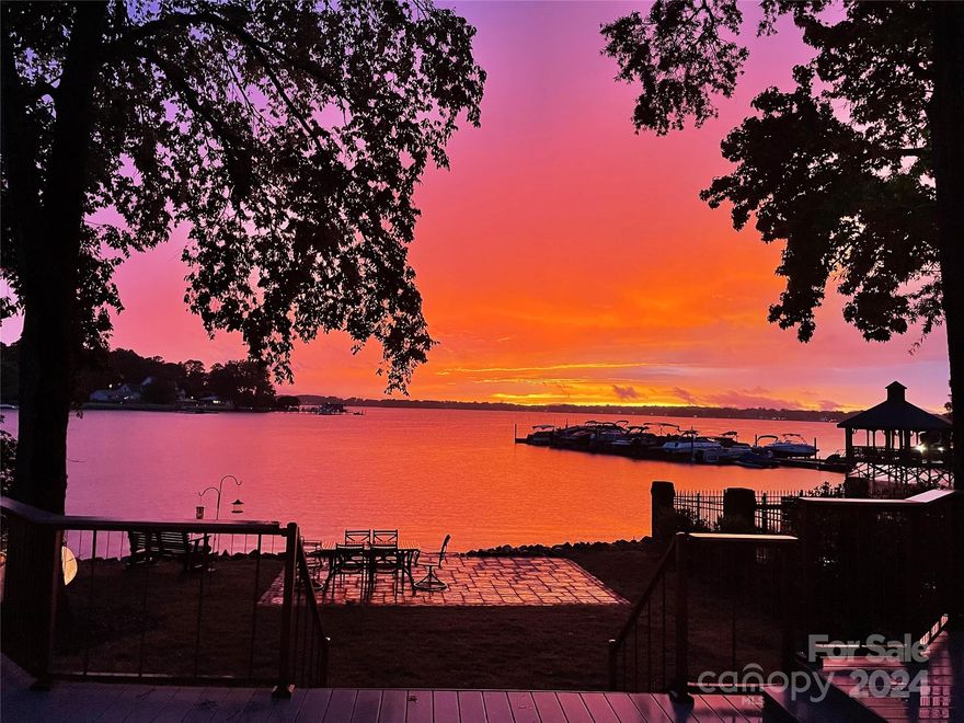 LAKE LIVING AT ITS BEST IN THIS CORNELIUS WATERFRONT GEM! Full Brick 4BD/4BA home on a breathtaking waterfront lot w/ direct main channel views!! This home has gone through a complete renovation inside & out with over $450,000 invested and 400+ additional Sq footage added. AMAZING VIEWS from throughout the home! The main floor showcases beautiful hardwoods and a living room bathed in natural light featuring a white brick fireplace. Gourmet kitchen w/center island, SS appliances, gas range and separate wet bar. The Primary bath is Luxury redefined! 2 additional bedrooms upstairs and 2 sizeable bonus rooms. A NEW ROOF and HVAC system installed in 2019. Outdoor living is a delight with a large deck w/Trex boards & custom metal railing. The backyard offers stunning views w/lakeside steps convenient for swimming & paddleboard/kayak launch. The HOA Fee covers full lawn service, dock, pool & tennis court maintenance. The community pool overlooking the lake & tennis court is a short walk away!