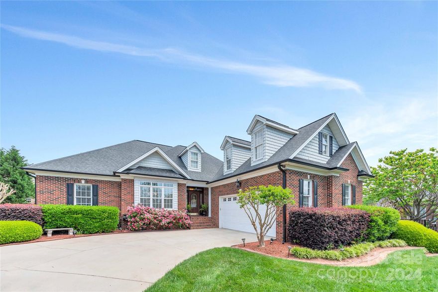 Sellers request highest & best offers by Sunday 5pm. Explore this custom brick home located in a peaceful cul-de-sac within sought-after Eagles Walk. High-end finishes, including new LVP flooring, multi-piece crown moldings, tall ceilings, and a charming fireplace. The kitchen is a culinary dream with granite countertops and black stainless appliances. The home features a main level owner's suite with its own sitting area, perfect for relaxation. Arched doorways contribute to the architectural beauty, and a side load garage adds convenience and curb appeal. Upstairs, a bonus area over the garage offers flexible space for entertainment or a home office. The outdoor living is unmatched with a covered patio area that includes built-in grills, a TV, a sound system, and a hot tub, creating an ideal environment for entertaining or tranquil relaxation. A privacy fence encloses the lush backyard. This property is a perfect blend of luxury, comfort, and convenience, ready to be called home.