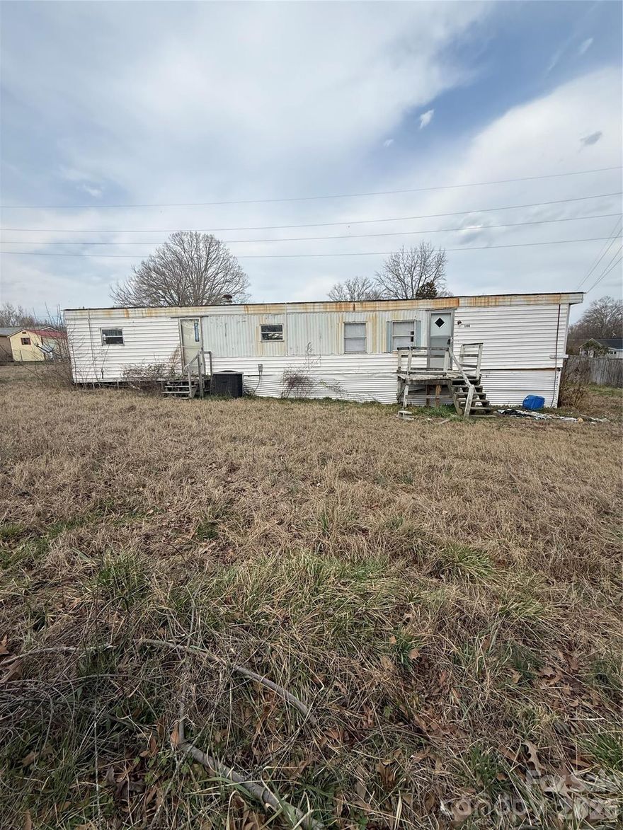 Great opportunity for investors or buyers looking for land with potential! This property features a parcel of land with an existing mobile home that will require significant repairs and updates. The home is not permanently affixed to the land and is titled separately. It currently has no central heating or air (window unit only) and no appliances.
The property was inherited, and the current owners have never occupied the home. Due to its condition, the home is being sold as-is with no repairs to be made by the seller.
Whether you’re looking to renovate, replace, or utilize the land for a new build, this property offers plenty of possibilities. Bring all offers!

Also listed as Residential - see MLS#4352022 for additional details.
