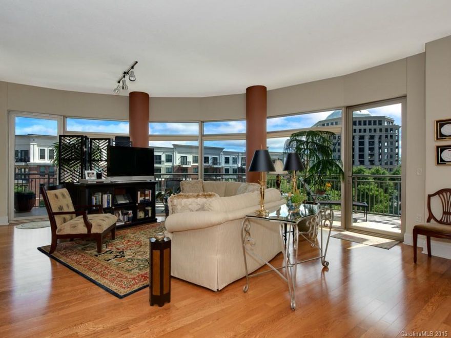 Rare opportunity to purchase the largest floor plan in perfectly-located Piedmont Row with on-site dry cleaner, salon and restaurants. Huge covered terrace wraps around floor-to-ceiling windows in dining/living space that opens to kitchen. Split bedroom floor plan includes separate office. Custom window treatments throughout. Secure building, secure parking, separate storage unit--are you ready to simplify your life?