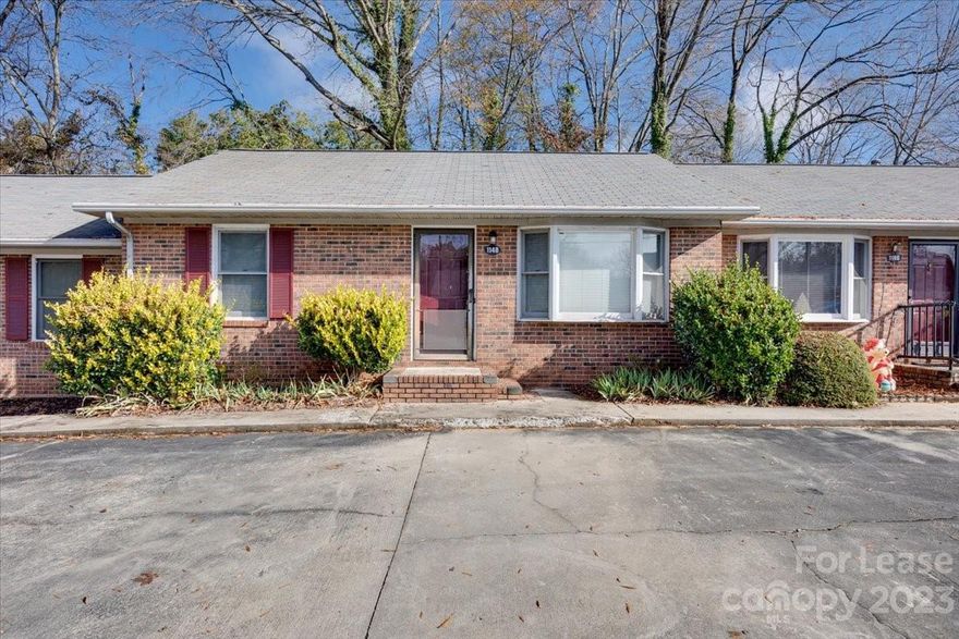 Super cute and well-maintained one-story condo.  Large open Kitchen with microwave and refrigerator included. Great cabinet and counter space with dining area in kitchen. Two nice-sized bedrooms. Primary has a half-bath en-suite with a Full bath in the hallway next to the 2nd bedroom. The laundry room is located off the kitchen at the back door with ample cabinets and a washer/dryer included.  There is a park across the street with a playground and walking trails. Convenient to I-77 and Cherry Park. **NO PETS**