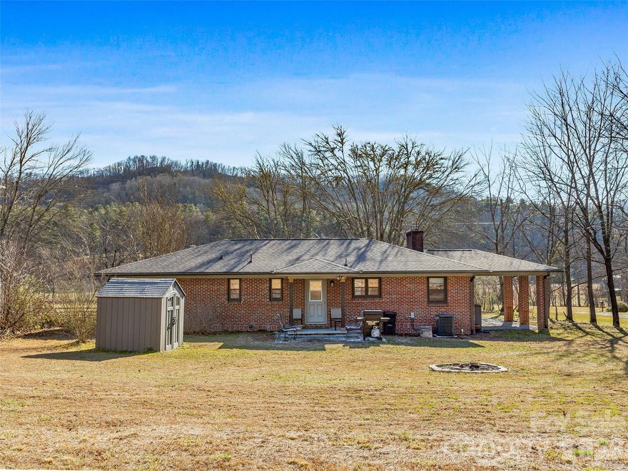 Just moments from the trails of Dupont State Forest, this beautifully renovated ranch home blends modern comfort with easy mountain living. Updated from top to bottom, every detail has been refreshed so you can move right in and start enjoying the lifestyle. The light-filled living room features a redesigned fireplace and flows seamlessly into a modern kitchen with custom cabinetry, granite countertops, and stainless steel appliances. Furnishings are included, making this a truly turnkey home. The primary suite offers a private en suite bath with a custom tiled shower and walk-in closet, while two additional bedrooms and an updated full bath provide flexible space for guests, work, or family—all on one level. Outside, enjoy a spacious, cleared backyard with mountain views and a peaceful, country-like feel, perfect for entertaining or gardening.