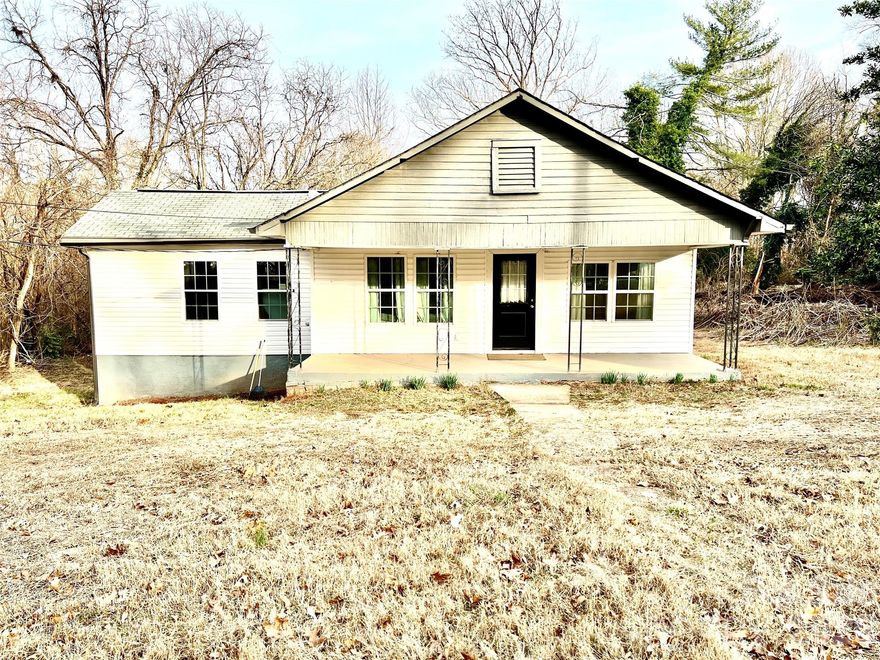 Discover the perfect blend of classic charm and contemporary updates in this move-in-ready 2 bedroom, 1 bathroom ranch style home. Situated on an expansive and level 0.91 acre lot, this property offers rare elbow room within city limits, featuring a spacious backyard. The living space has been thoughtfully designed with an open concept layout that maximizes natural light and flow. LVP flooring run throughout the home, offering a sleek, durable, and water resistant finish. The kitchen boast crisp white cabinetry, granite countertop, and a neutral color palette. Recent renovations include new hot water heater and new HVAC. The home has vinyl siding and updated windows for improved energy efficiency. Located just minutes from downtown Spindale's shopping and dining, and in close proximity to Isothermal Community College, and Hospital. Whether you are looking for an ideal starter home, a manageable space to downsize, or potential investment property, give this property a look.