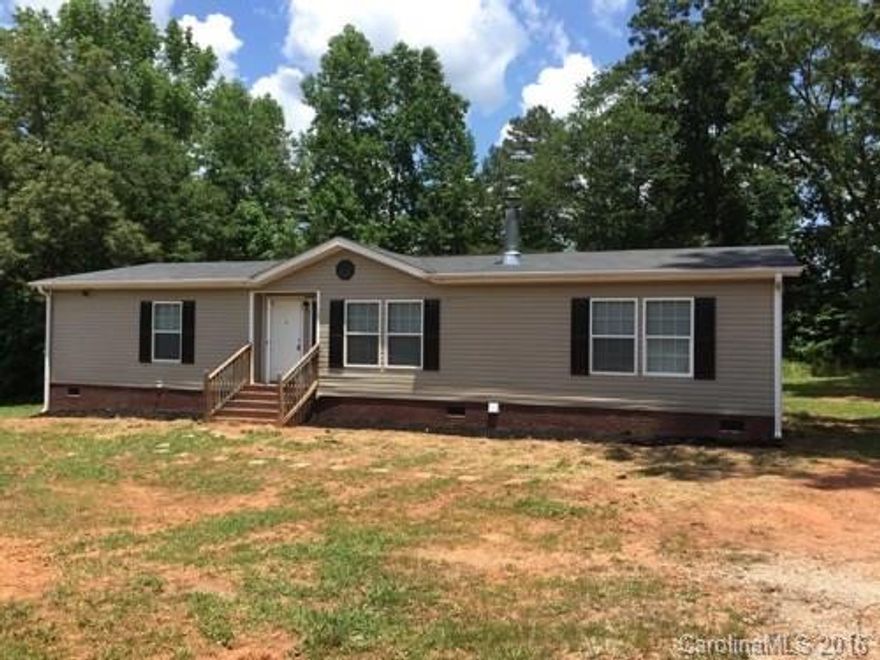 Like New 2010 Oakwood Double Wide Brick Underpinned Stone Fireplace Island Kitchen Garden Tub Separate Shower New Floor covering Central Heat and Air List Price includes New Kitchen Appliances Well Septic 1 Acre Financing for most credit situations.