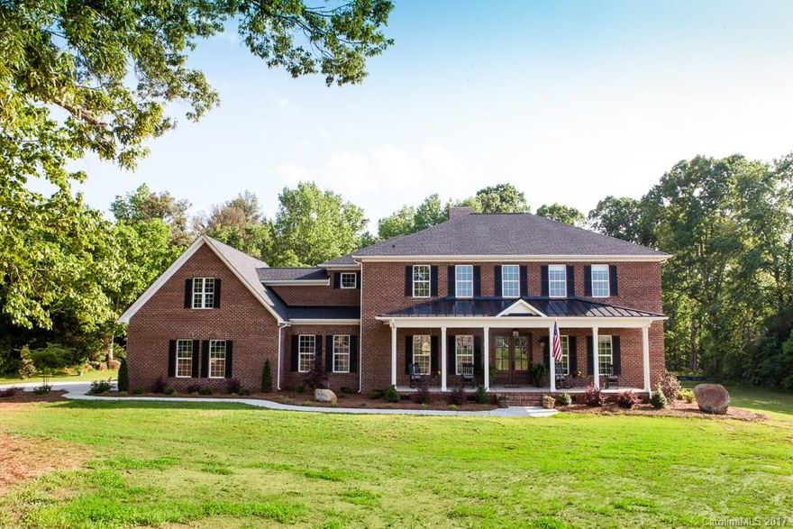 Breathtaking custom brick home on 1 acre in a quiet cul-de-sac w/ huge rocking chair front porch. 10 ft ceilings on main, 8 ft ceilings upstairs.  Gorgeous quartz island/counters in gourmet chef kitchen with double ovens.  Huge walk in pantry. Master on main w/ incredible bathroom! Walk-in shower, stand alone tub and huge walk-in closet. Oversized bonus room w/ wet bar, office & full bath. Oversized bedrooms. Outdoor kitchen w/ fireplace, gas grill. 3 car garage w/ half bath.  No HOA! Must see!