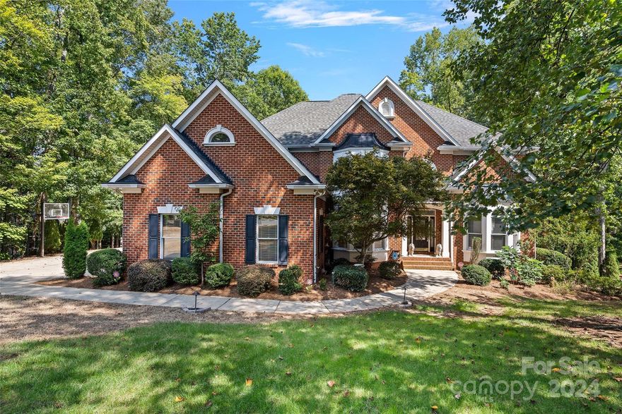 Stunning brick 6 bedroom, 5.5 bathroom basement home on a private cul de sac lot that is almost an acre! This home has it all from the open floor plan to the incredible basement, to the beautiful in ground pool! Enjoy movie night in the Media Room or gather around the fire-pit overlooking the backyard! Upstairs find the Primary Suite with a huge sitting area, spa like bath & spacious primary closet. The secondary bedrooms are spacious with huge walk-in-closets! On the main level is a perfect guest suite! The walk out basement is ideal for 2nd living area, entertaining, working out and provides a MASSIVE unfinished storage space! Fantastic location only minutes to shopping, entertainment districts & much more! Private walking trail to Weddington schools attached to the neighborhood and only for this neighborhood!