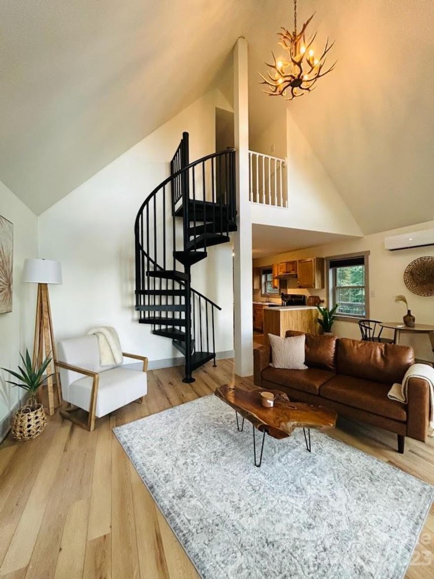 Enjoy stunning Long-Range Views from this brand-new construction home located just outside the city limits of Blowing Rock. Bask in the breathtaking sunsets from the expansive wrap around deck or while sitting inside, viewing through expansive and numerous windows in the Living Room. The open concept living area, adorned with soaring ceilings, offers a warm welcome into this fully furnished abode. Home is equipped completely down to the linens and utensils. The Loft Bedroom is open and spacious with additional storage. Vacation rentals are allowed, or this home would serve as a permanent residence as well. Lots of room to roam on 2.74 Acres.