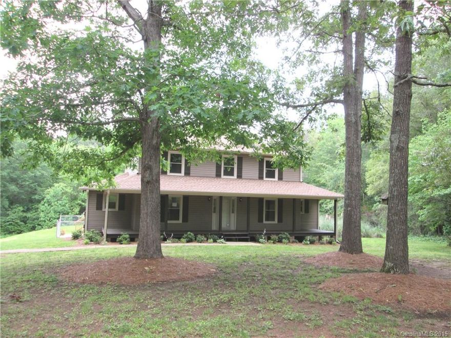 8+/- AC surrounds this 3BR/3BA home with updates galore! New roof, windows, vinyl siding, and large deck on the outside. New carpet, paint, and SS appliances inside. Large master up, bayed breakfast area, masonry gas log fireplace in the great room, full bath down, office/small 4th bedroom down. Large front porch, patio, fencing. Separate guest house as is. Bank owned by Founders Federal - sold as is.