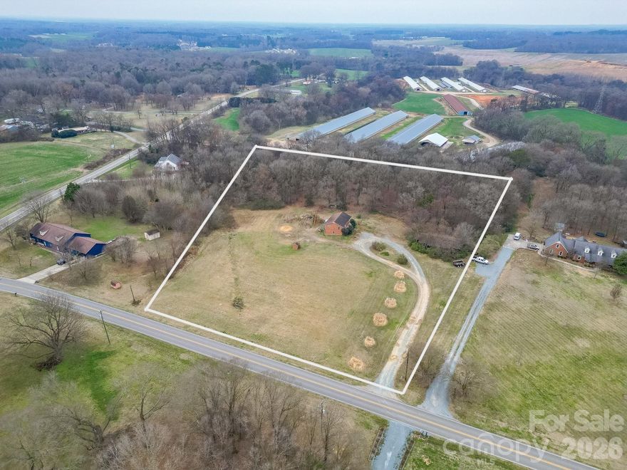 Spacious 7-acre property in Unionville featuring cleared areas and beautiful mature trees. The property includes a home being sold as-is and an additional house that was moved onto the land but has never been connected to utilities. Plenty of space and potential to customize or utilize the land to suit your needs.